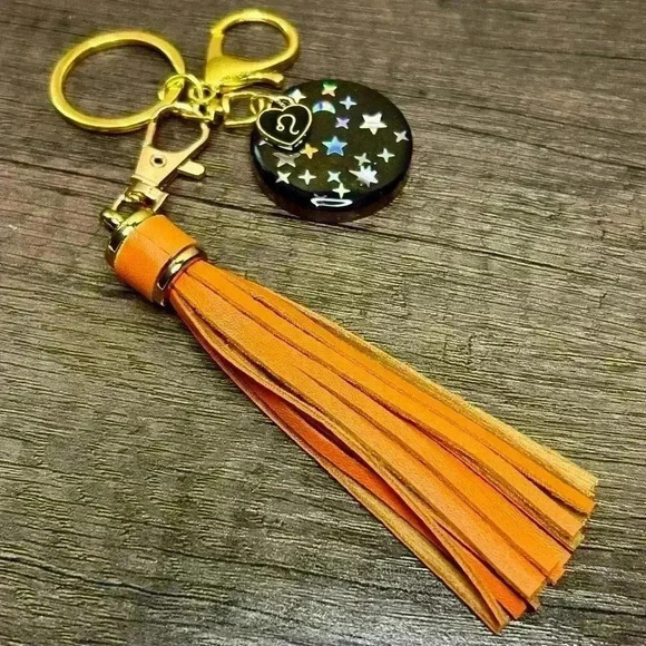 Hand Crafted Medallion Leo Charm and Orange Tassel Gold Tone Keychain - Picture 2 of 2